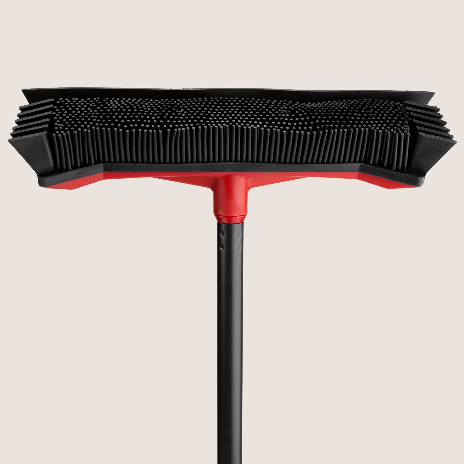 Close-up of the Roamwild garden broom rubber head and side blades