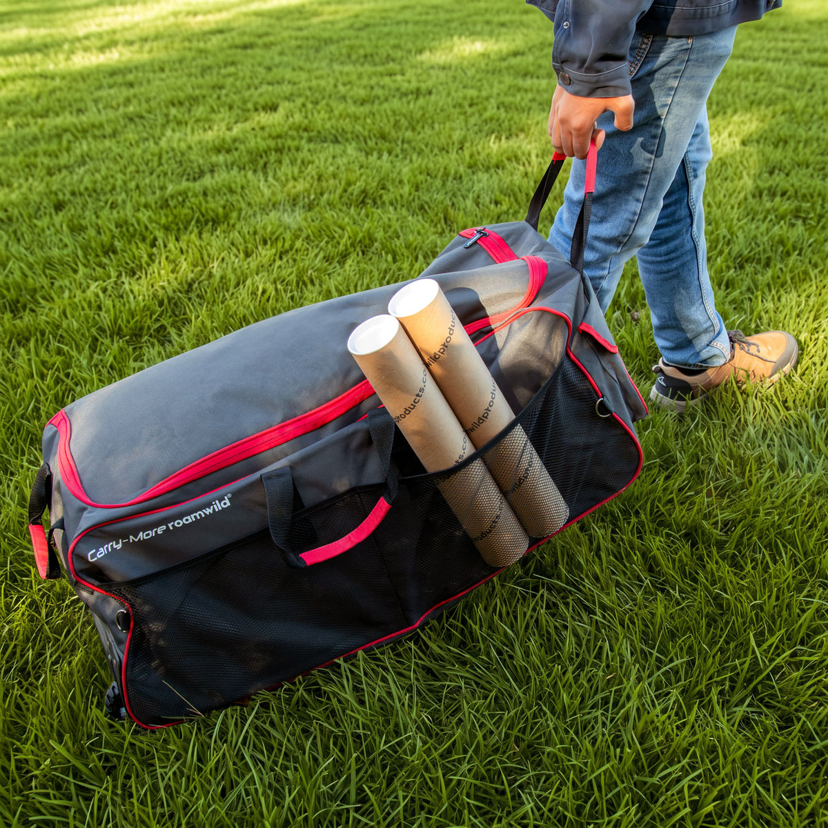 Carry-More being pulled across a lawn on its handle
